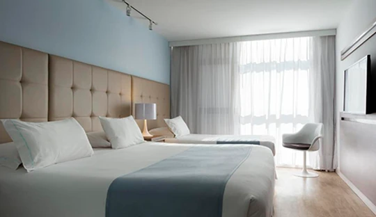 dormitorio_camas_individuales_hotel_vivaldi.webp